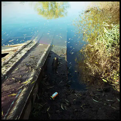An old barge sunk and still partly showing in the River Aire