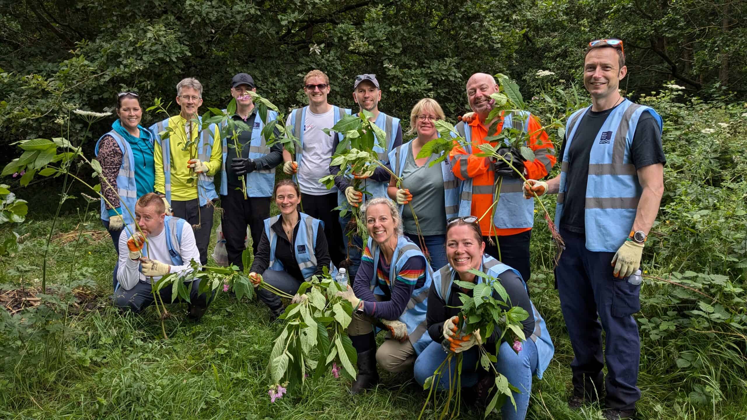 A large group of people volunteering to improve the river